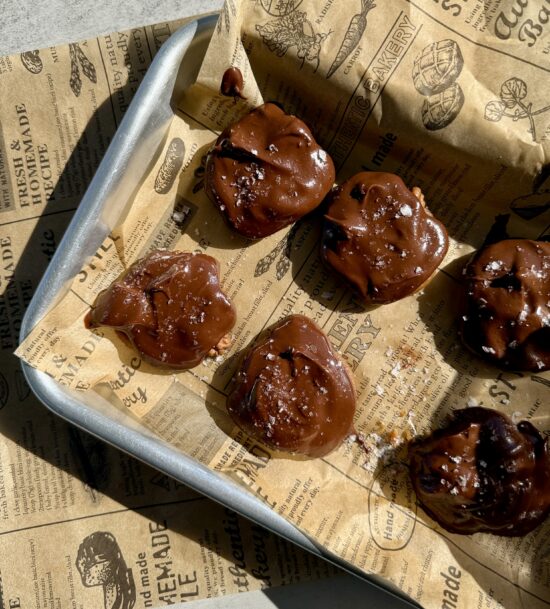 The Ultimate Clean Chocolate Turtle Recipe : chocolate turtles sitting on parchment paper